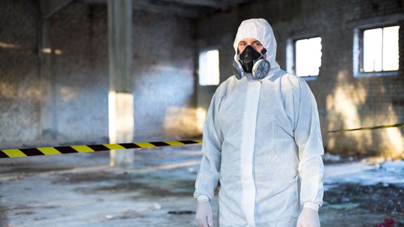 Contractor in building with respirator mask